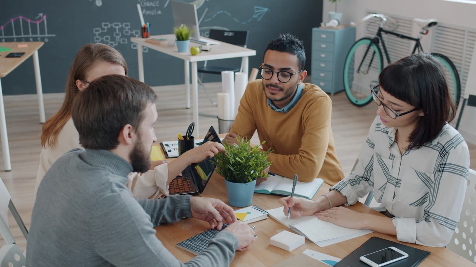 Team members collaborating around a table