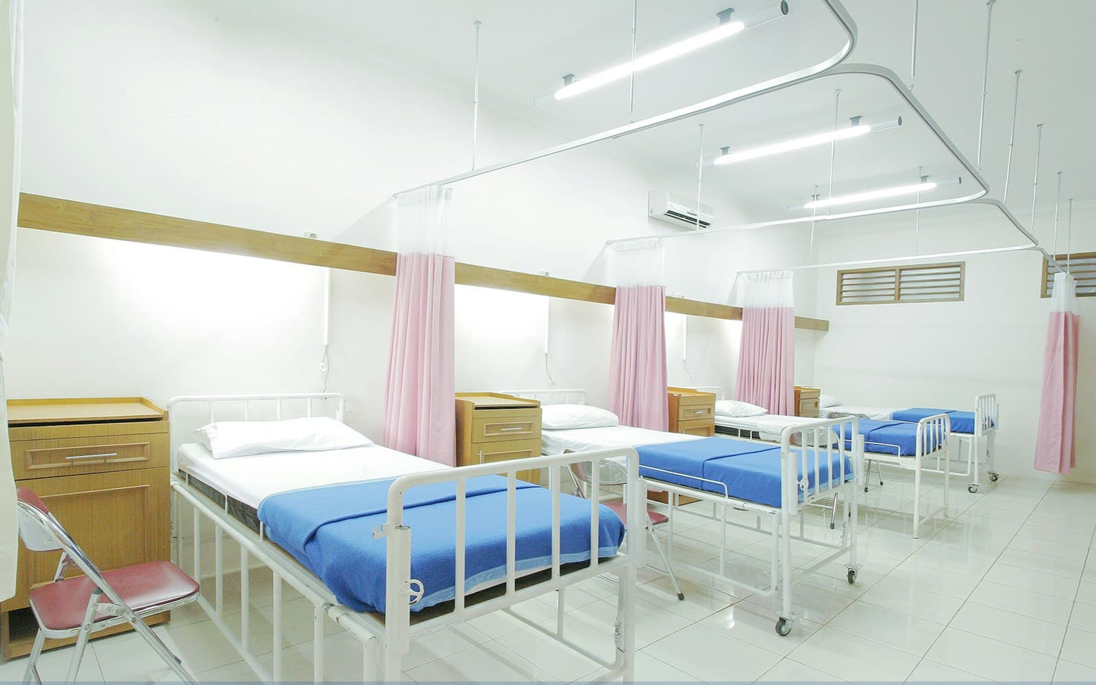 Clean, well-lit hospital ward with beds